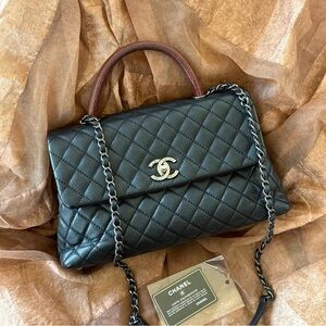 CHANEL Black Quilted Leather Bag with Brown Handle